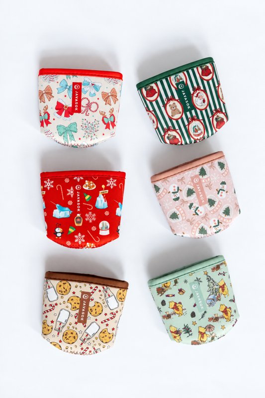 Six colorful JavaSok drink sleeves arranged on a bright background