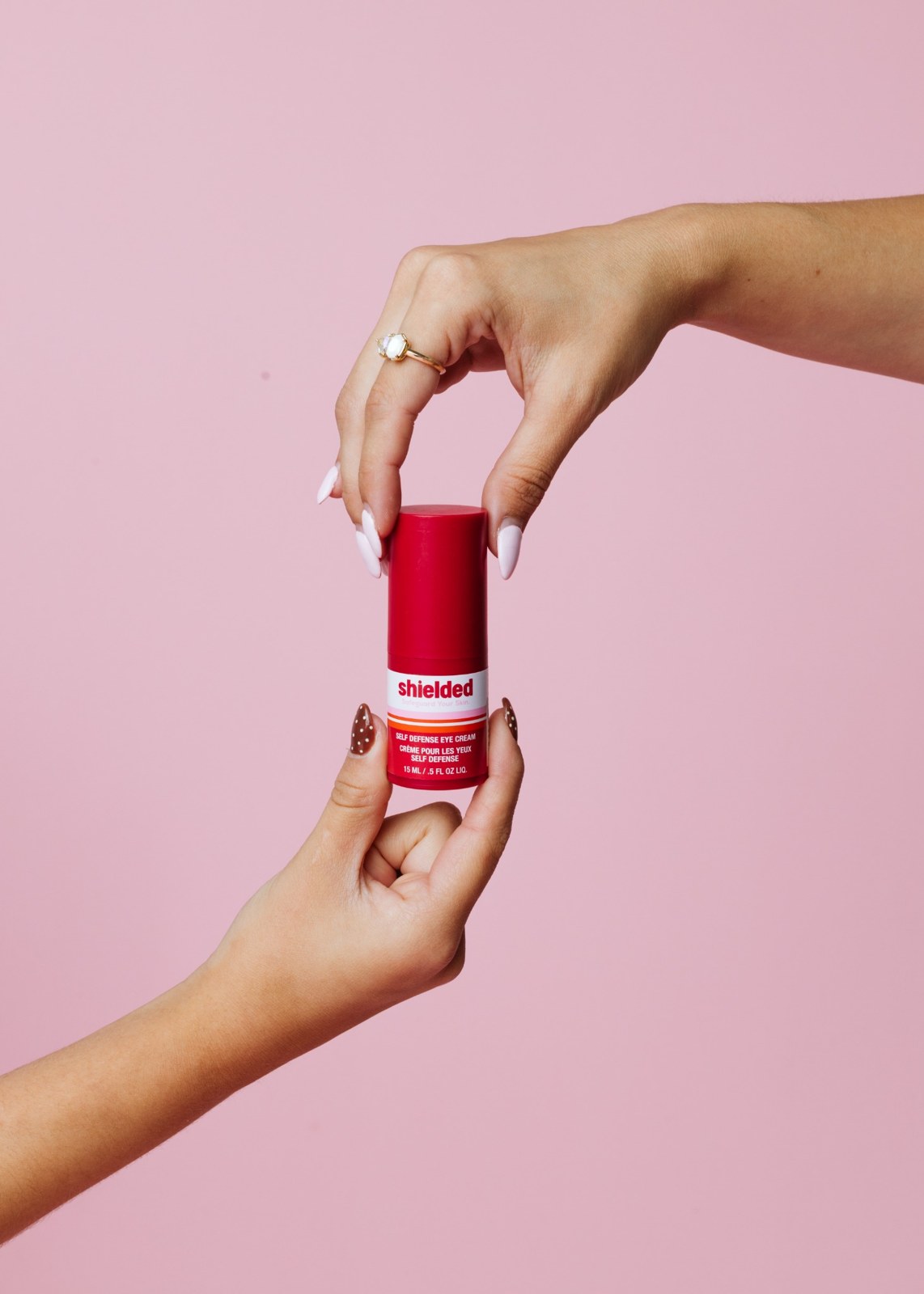 Colorful product photography against a pink backdrop