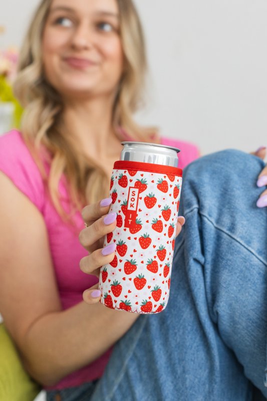 A model holding a tumbler in a patterned Sok-It sleeve